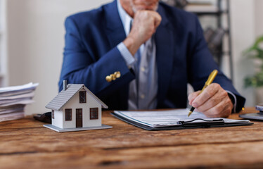 Real estate broker agent presenting and consult to customer to decision making sign insurance form...