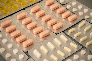 Various types of medication arranged on a surface in an organized manner
