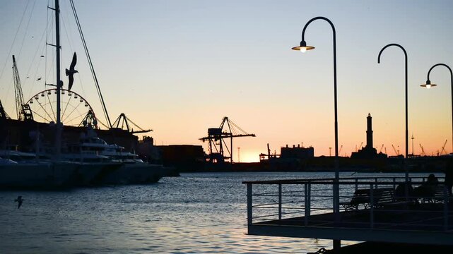Port of Genoa with the iconic Lanterna at sunset from the "Isola delle chiatte"