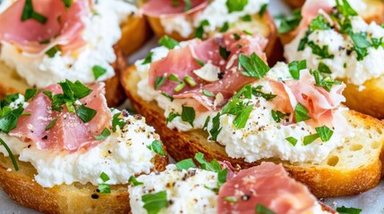 Gourmet Crostini with Prosciutto and Ricotta:  Close-up of mouthwatering crostini topped with creamy ricotta cheese, thinly sliced prosciutto, and fresh herbs. Perfect for appetizers, party snacks.
