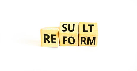 Reform and result symbol. Concept words Reform Result on beautiful wooden block. Beautiful white...