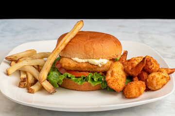 fish sandwich  with breaded shrimp and fries