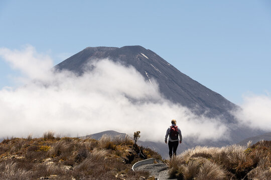 Hiker on the Tongariro Alpine Crossing with Mount Ngauruhoe, New Zealand