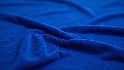 Luxurious royal blue velvet fabric showcasing light and shadow play