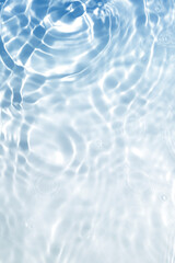 Tranquil Blue Water Surface with Gentle Ripples and Light Reflections