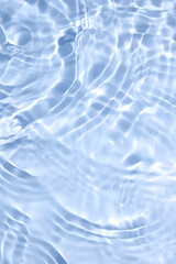 Obraz premium Blue Water Surface with Gentle Waves and Reflections in Sunlight