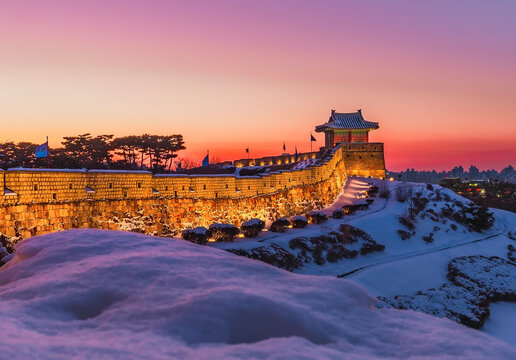 Beautiful evening light Sunset at Hwaseong Fortress on Suwon City Wall in winter Snow covered Hwaseong Fortress, Suwon, South Korea Highlights during sunset Image of Hwaseong Fortress, a UNESC World H