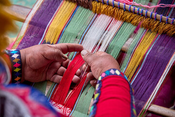 The hands of a weaver hold generations of skill, patience, and creativity, turning simple strands into works of art. Each weave is a journey, each knot a memory.  Chinchero Cusco Peru.