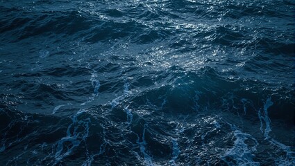 Fototapeta premium Moonlit ocean waves with silver highlights creating shimmering textures