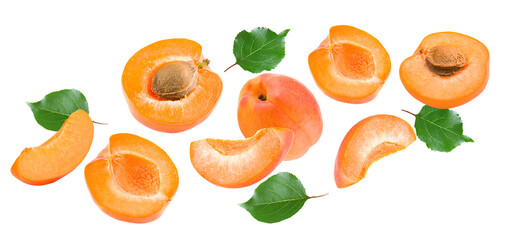 flying apricot fruits with slices and green leaf isolated on white background. clipping path