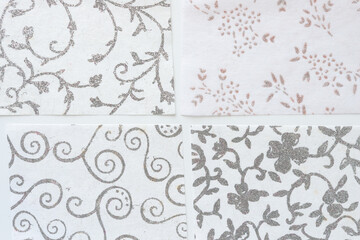 set of four felt-like crafting paper sheets with silver glitter patterns