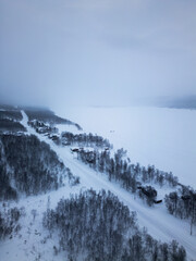 Obraz premium Winter Aerial View of Snowy Mountain Landscape in Northern Sweden – Cloudy Day