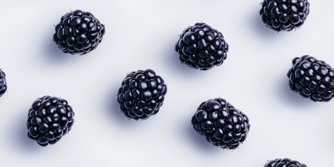 Realistic fresh blackberries scattered on a pure white background, highlighting their vibrant tones and natural texture in a crisp, minimal composition
