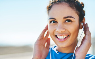 Girl, runner and happy with earphones, outdoor and audio for workout, portrait and mockup space....