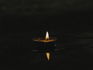 A single candle flame burning in the darkness isolated on black background, simple minimalistic aesthetic stock photo, high quality --ar 4:3 --v 6.1 Job ID: 483cd1cb-2a90-4a37-af67-374bb2aa8f78