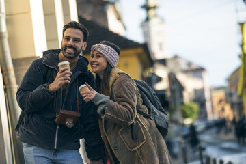 Hugged Tourist Couple Drinking Coffee