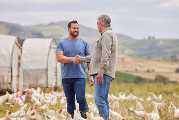 Happy men, chicken farm and handshake with livestock for agro business, partnership or agriculture in countryside. Businessmen, agreement or shaking hands with smile for natural growth or production © peopleimages.com