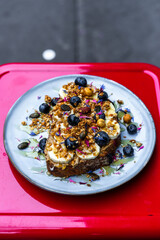 Banana Bread with Sliced Banana, Blueberries, Granola, and Honey – Paris Café Delight