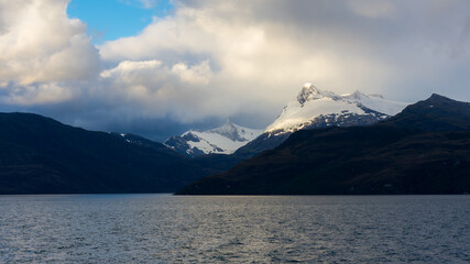 sailing through the mountainous region of the national park Alacalufes, Chile