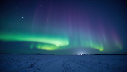 Naklejka premium Majestic Northern Lights Dance Over Snowy Landscape at Night Sky