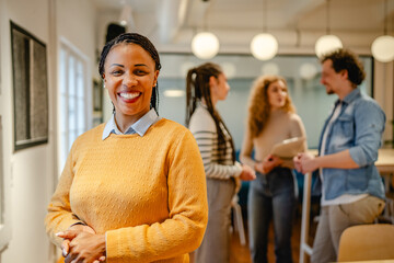 Obraz premium portrait of happy african american woman stand arm crossed at office