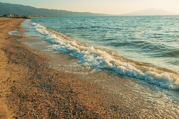 Vrasna beach, beautiful seaside landscape with sea waves splashing the sandy shoreline