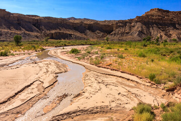 A river runs through a desert landscape