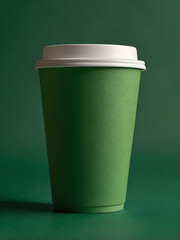 paper cup of coffee on green