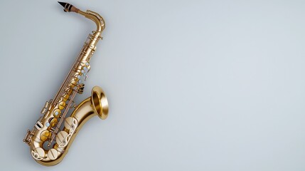 Gold alto saxophone on grey background, music instrument