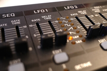 Sliders of a synthesizer. Sequenzer slider and two sliders for low frequency oscillator.