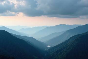Obraz premium Foggy mountain landscape with misty smoke and dark grey clouds, mountains, clouds