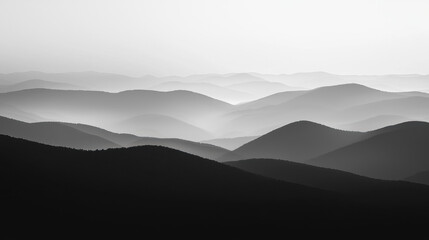 Monochrome layered mountain landscape with soft atmospheric depth