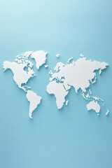 Obraz premium A white cut-out world map on a light blue background, symbolizing global exploration and connectivity