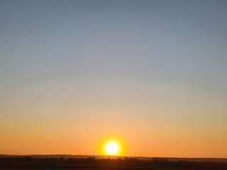 Sunset on a cloudless winter day - the view reaches to the horizon