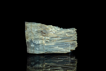 Calcite under long wave UV. photography isolated on black background. macro detail close-up mineral...