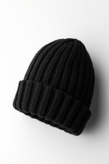 a black beanie on a white surface