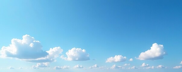 Thin white clouds scattered in a clear blue expanse, peaceful, serene