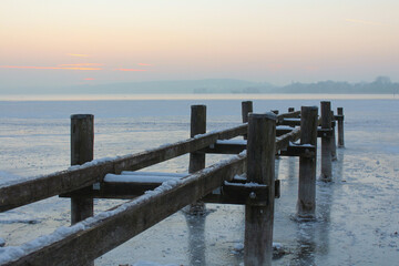 frozen lake during sunset.