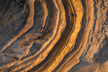 Panoramic of open pit mine industry, aerial view. Big yellow mining truck for coal working in quarry