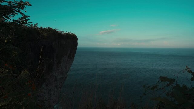 Karang Boma Cliff Bali on background ocean waves crashing on the tropical beach Bali Indonesia 4K