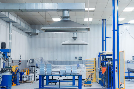 Modern industrial factory interior with equipment and ventilation systems