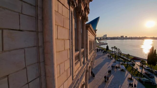 The video begins with a breathtaking aerial view of Baku at sunrise, as the golden light reflects off the Caspian Sea. 