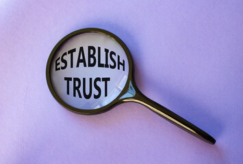 Establish trust symbol. Magnifying Glass with Concept word Establish trust. Beautiful purple...