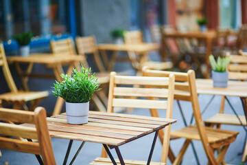 Empty wooden table of an outdoor cafe in Reykjavik, Iceland.