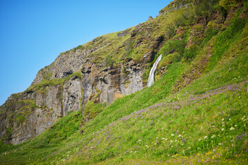 Naklejka premium Scenic view of Gljufrafoss near Seljalandsfoss, one of the biggest waterfalls of Iceland, with rainbow.