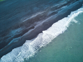 Aerial scenic view of Reynisfjara black sand beach near Vik in Southern Iceland.