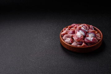 Raw chicken or turkey gizzards with salt, spices and herbs