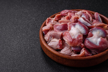 Raw chicken or turkey gizzards with salt, spices and herbs
