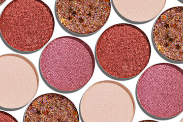 Eyeshadow palette, mix of shimmer shades in pink, red, brown, purple hues. Minimal top view pattern for beauty, makeup, cosmetic themes, Vivid shine colored swatches eyeshade refills round shape