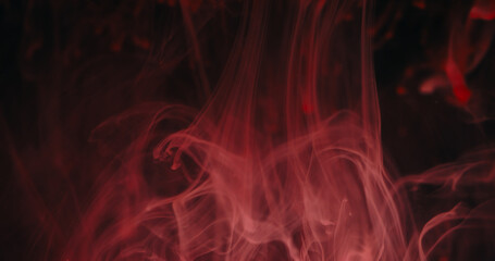 Ink drip blend. Blur paint mix. Defocused pink color shine liquid drops flow fluid smoke texture wave on abstract dark black background.